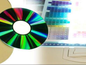 cd-roms floating over pantone color sheet